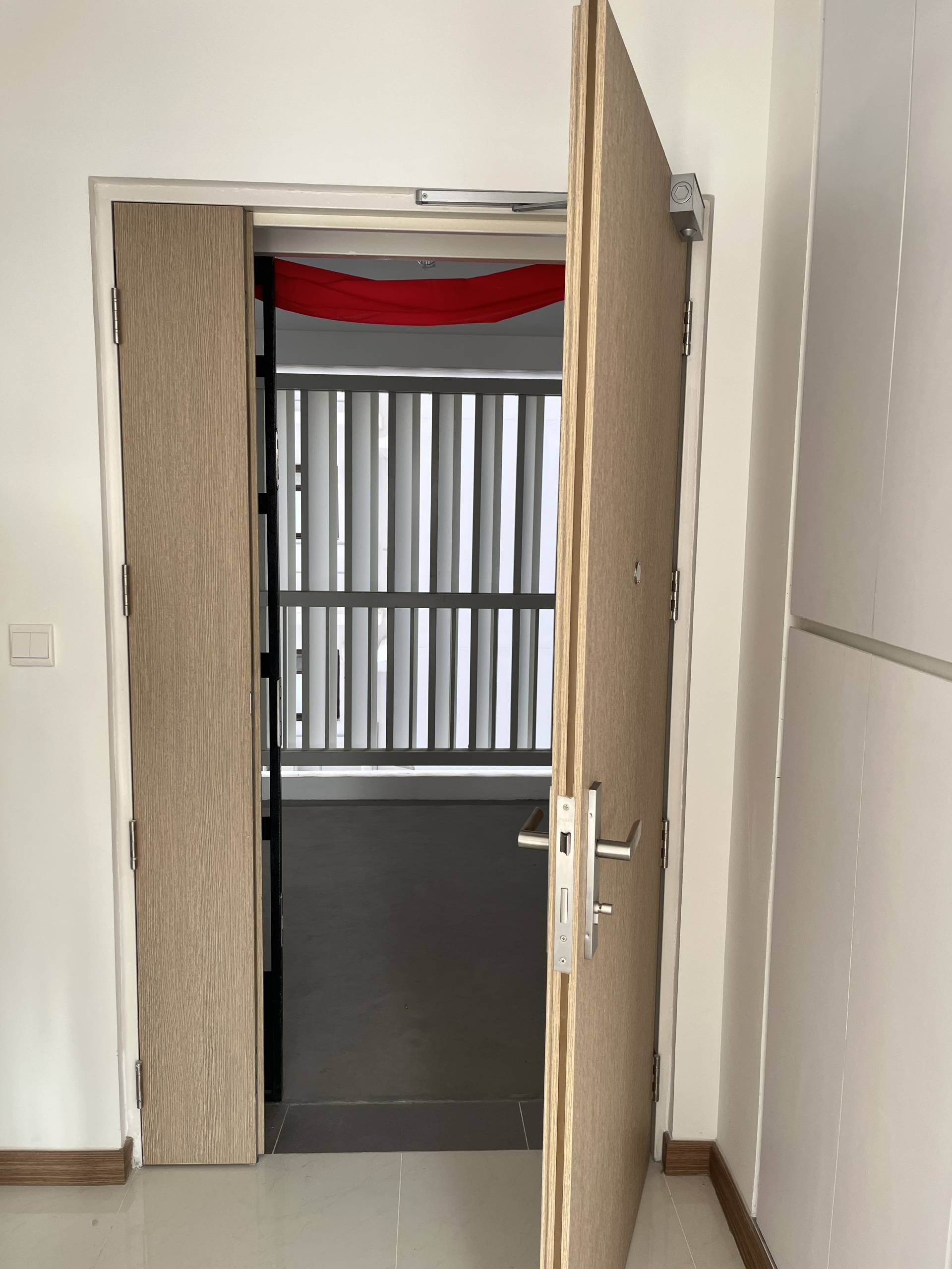 New laminated timber door installation in HDB flat
